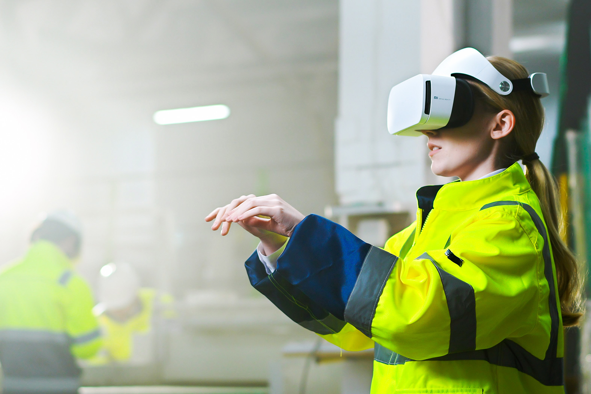 Civil engineering worker using VR headset and futuristic interface powered by digital transformation services by Unipolar